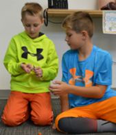 Aiden Vermerlen and Kevin Simo get ready to chuck pumpkins