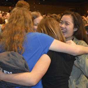 Freshman Lecia Strunk, right, celebrates the surprise announcement with friends from the marching band
