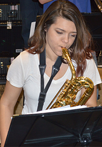 Junior Lauren Elliott plays the baritone saxophone