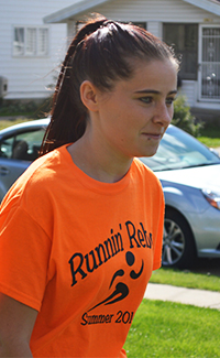 Jordan Lovett warms up for cross-country practice
