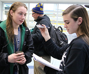 Sports reporter Molly Donovan interviews senior Felicity Buchmaier after her win at the Division 2 state swim championship in October (photo courtesy Tricia Donovan)