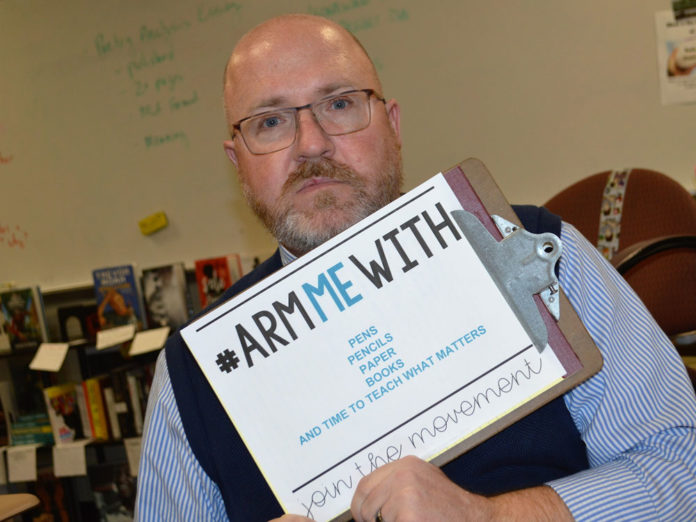 LOW-guns-interview-1 Jeffrey Larsen, Lowell High School AP literature teacher, would rather be armed with school supplies