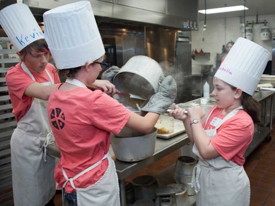 Kevin Williams, eighth grade, Lee Middle; Allie Hoven, seventh grade, Wyoming homeschooler; and Isabella Marino, seventh grade, Grand Rapids homeschooler; work as a team to strain burrito sauce