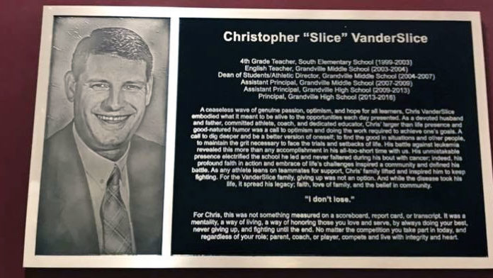 VanderSlice-1 A plaque documenting high school principal Chris VanderSlice’s work in the district has been mounted in the athletic wing